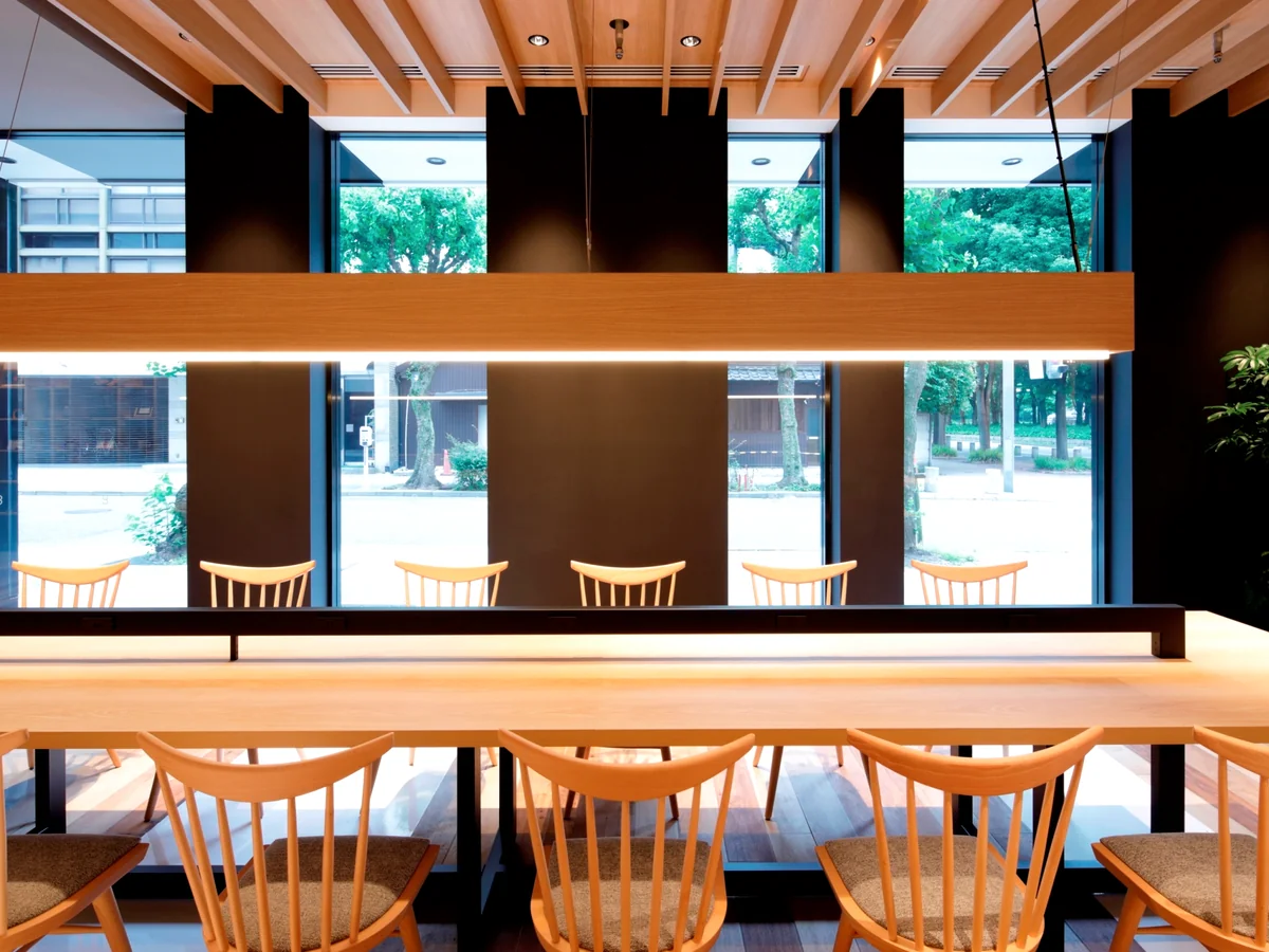 A space with long tables and individual outlets, perfect for working.