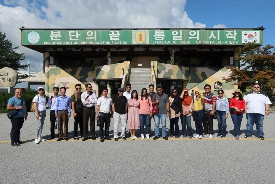 A group photo taken during the Dora Observatory tour, overlooking North Korea.